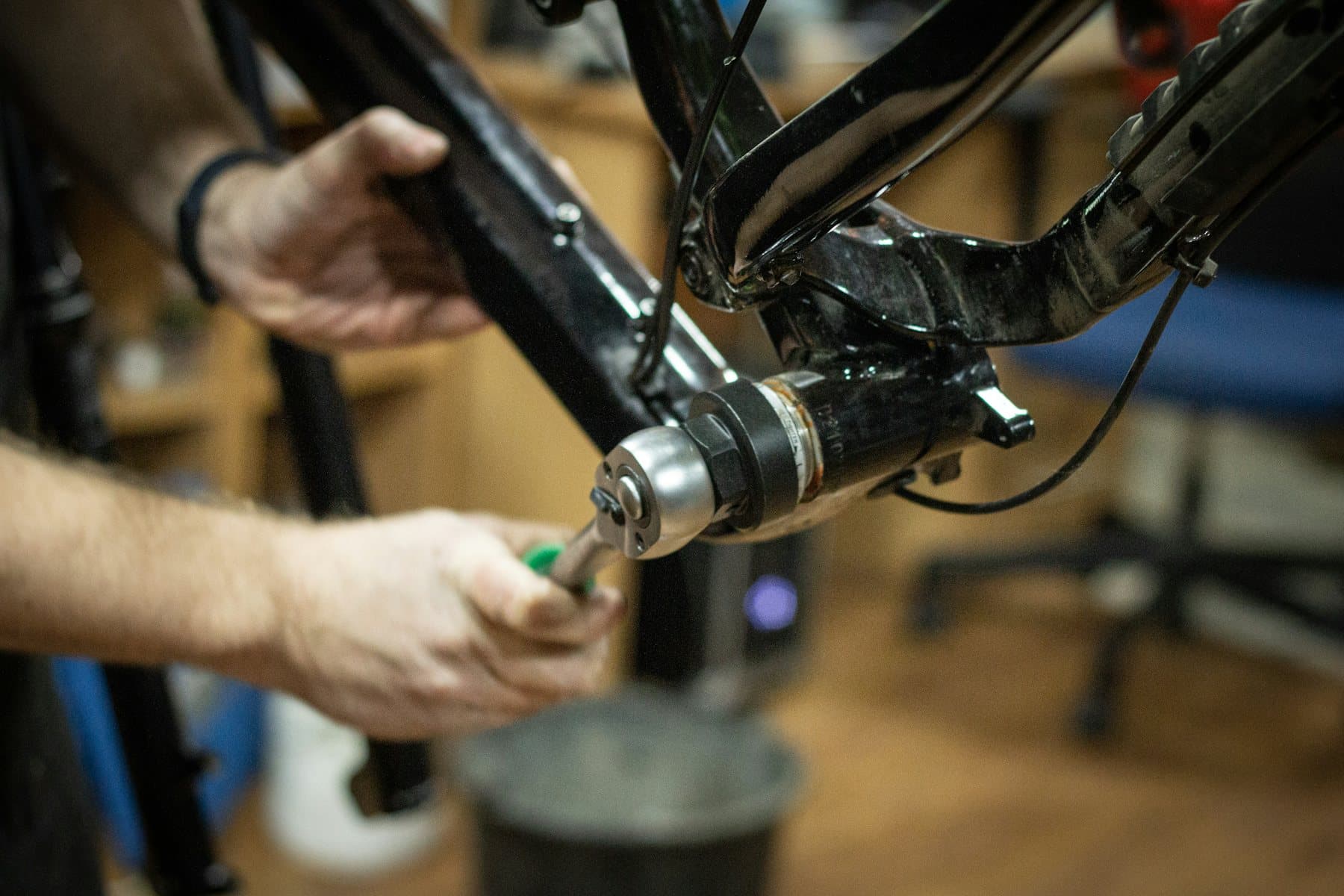 Hands inspecting a carbon component — the part of sourcing that doesn't fit on a spreadsheet.